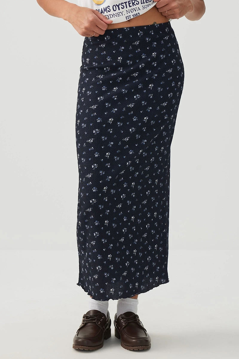 Jupe midi fleurie à bordure frisons