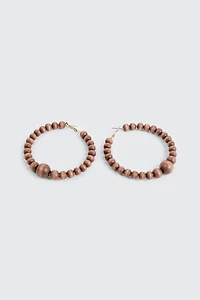 Ardene Wood Beaded Hoop Earrings in Brown | Stainless Steel