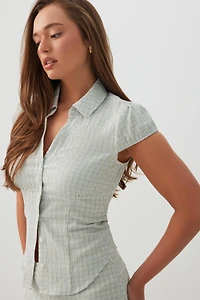 Blouse ajustée à mancherons carreaux