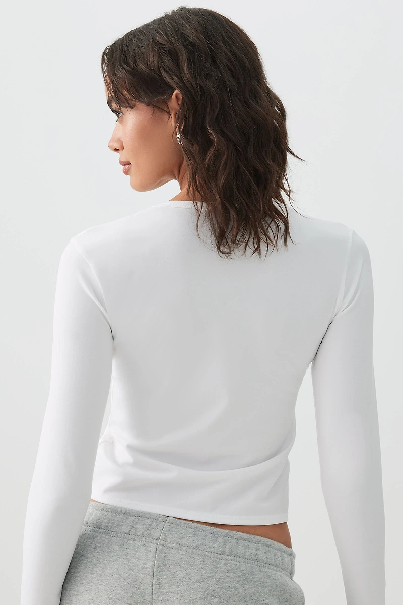 Haut ajusté à manches longues