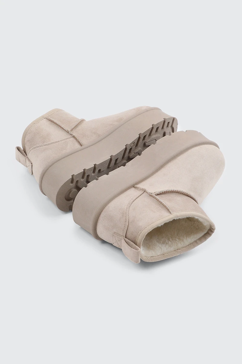 Bottes plateformes mini en faux mouton