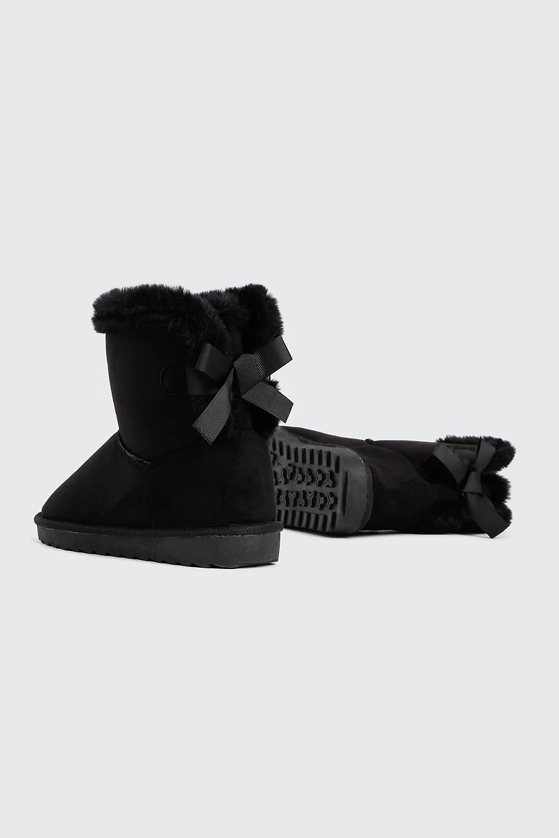 Bottes plateformes en faux mouton à boucle
