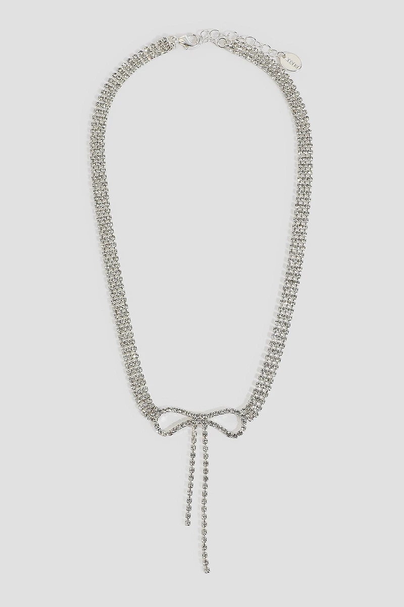 Ardene Rhinestone Bow Necklace in Silver