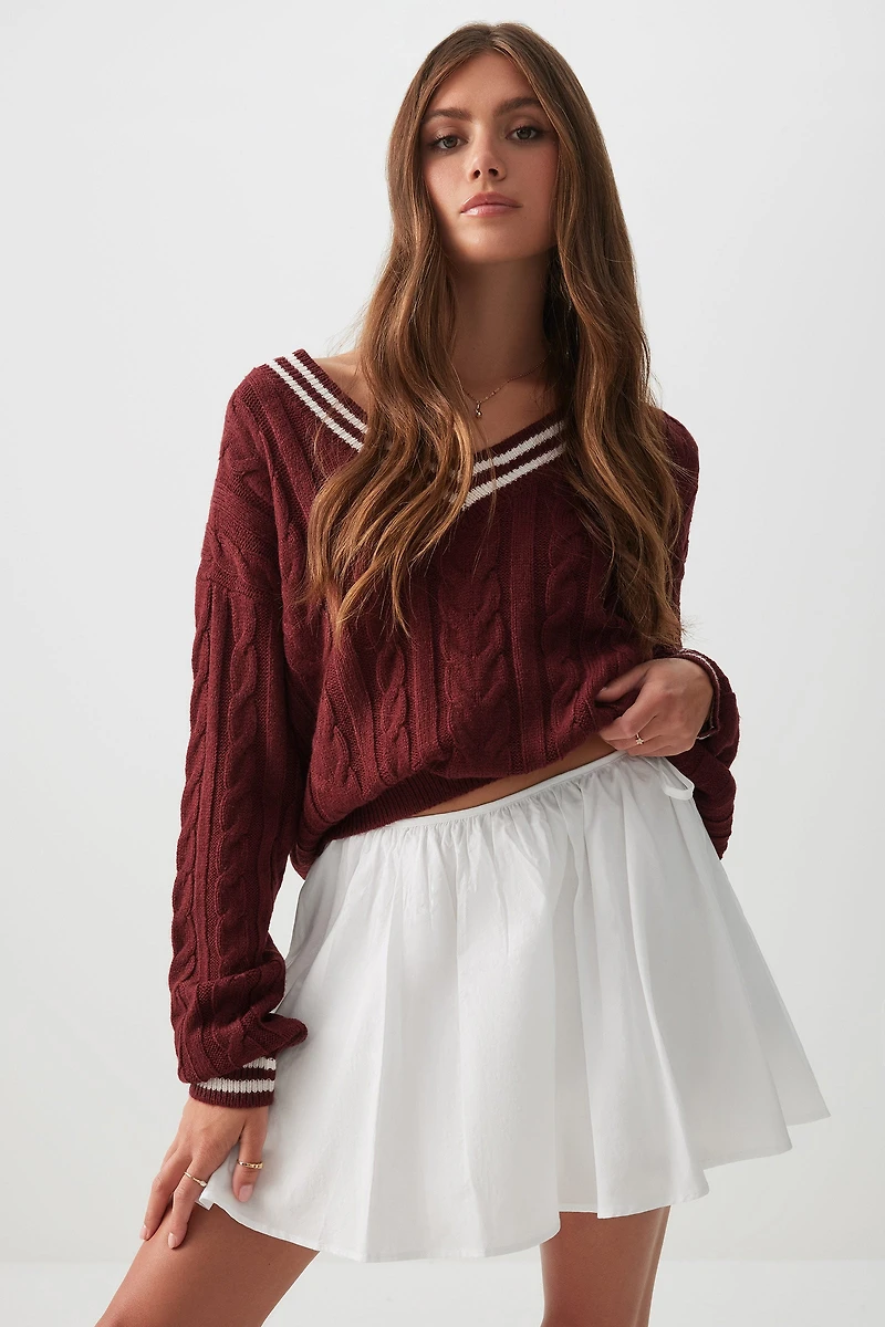 Microjupe circulaire à boucles latérales