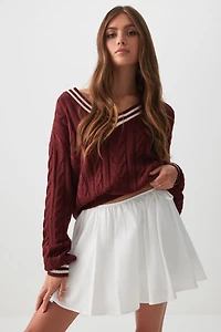 Microjupe circulaire à boucles latérales