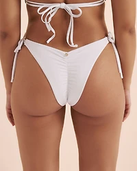 Bas de bikini brésilien taille basse brillant à franges