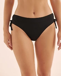 Bas de bikini à nouer sur les côtés découpes