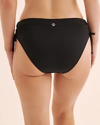 Bas de bikini à nouer sur les côtés découpes