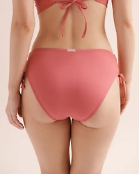 Bas de bikini taille basse gainant à nouer côtel