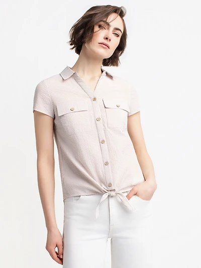 Sleeveless blouse with buttons