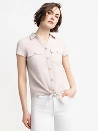 Sleeveless blouse with buttons