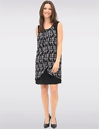 Versatile Black & White Sleeveless Dress with Printed Flowy Overlay by Devia