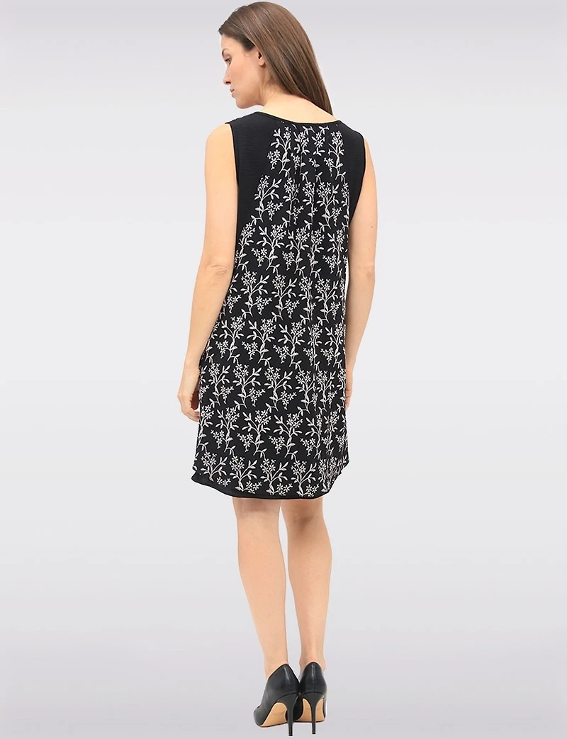 Versatile Black & White Sleeveless Dress with Printed Flowy Overlay by Devia