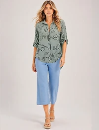 Elegant High-Low Button-Up Shirt with Abstract Script Design by Froccella