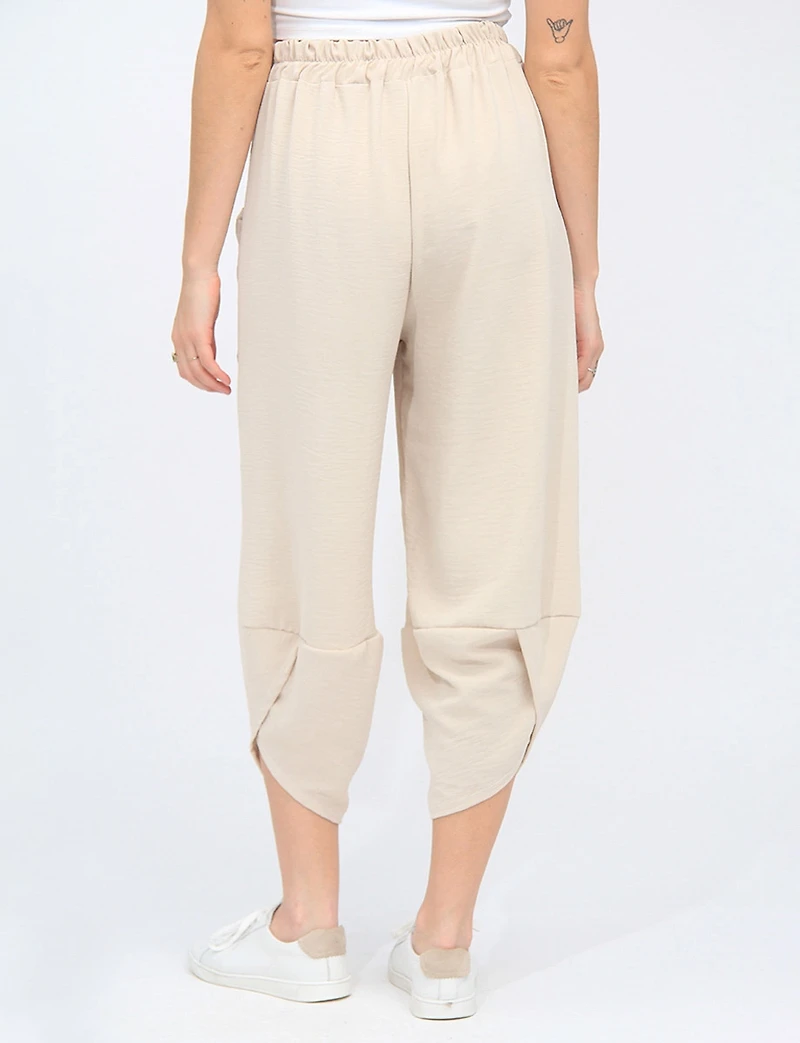 Elastic Waist Asymmetrical Hem Balloon Pant with Patch Pockets by Froccella