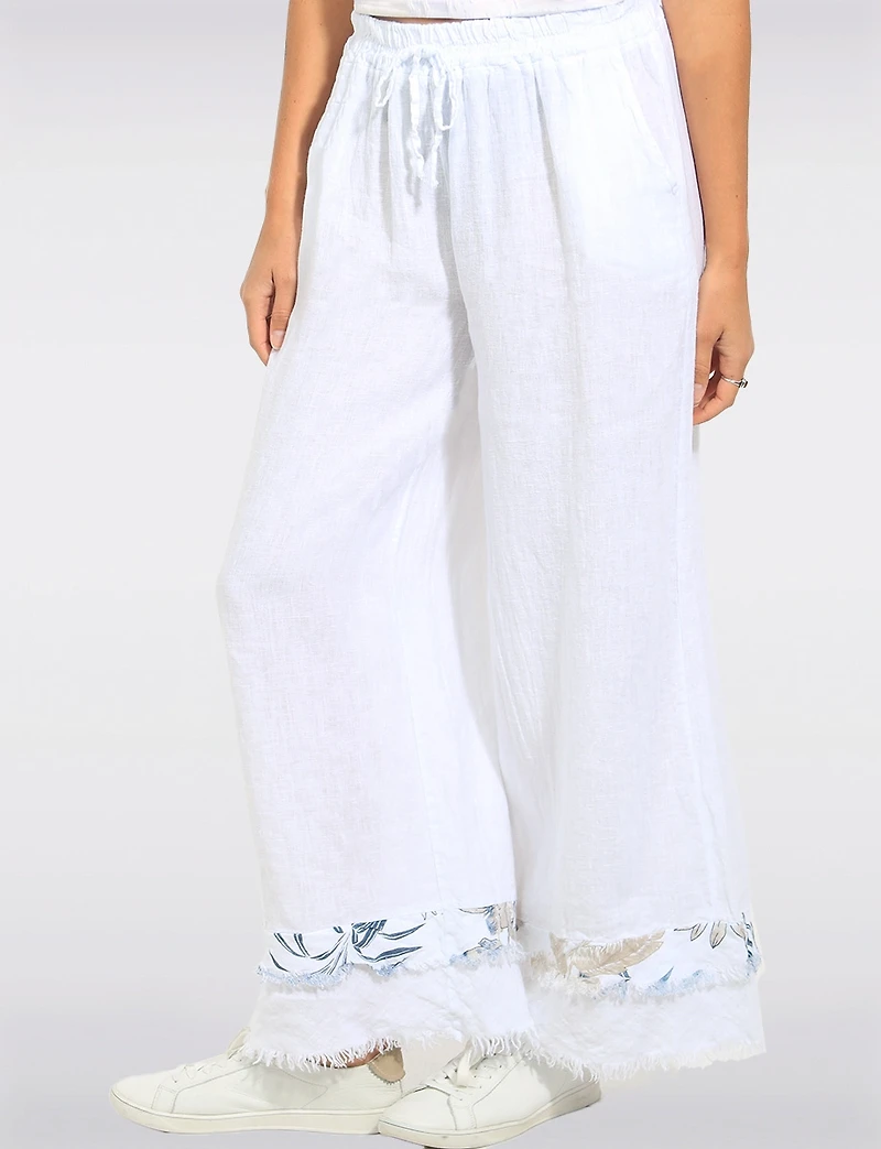 White Linen Wide Leg Pants with Frayed Hem and Floral Accent by Froccella