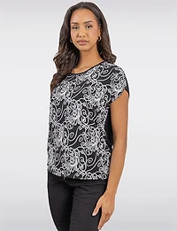 Chic Black & White Printed Cap Sleeve Top with Asymmetrical Hemline by Vamp