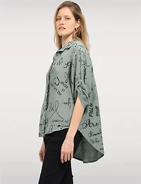 Elegant High-Low Button-Up Shirt with Abstract Script Design by Froccella