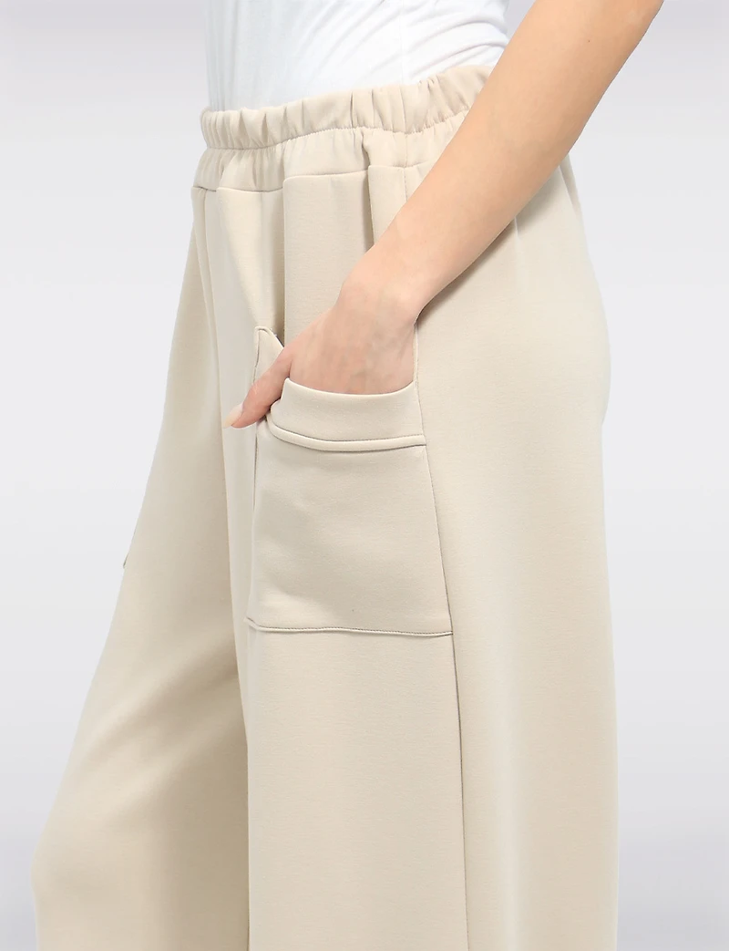 Elastic Waist Asymmetrical Hem Knit Balloon Pant With Patch Pockets By Froccella