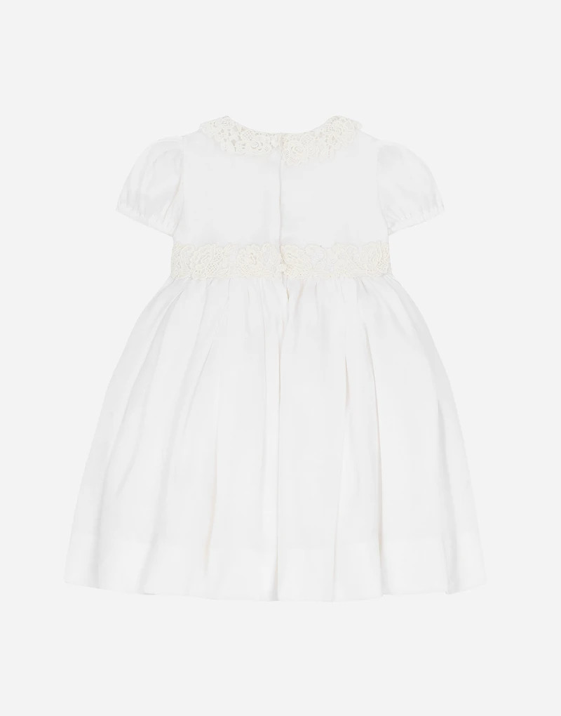 Empire-line muslin christening dress with short sleeves