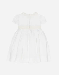 Empire-line muslin christening dress with short sleeves