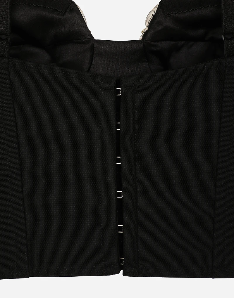 Corset top with rhinestone embellishment