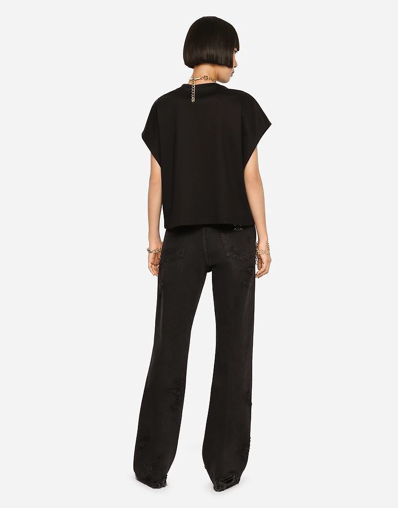 Flared jeans with ripped details