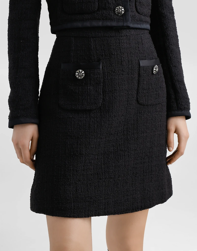 Short raschel tweed A-line skirt with bejeweled buttons