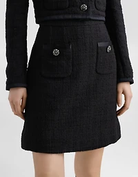 Short raschel tweed A-line skirt with bejeweled buttons