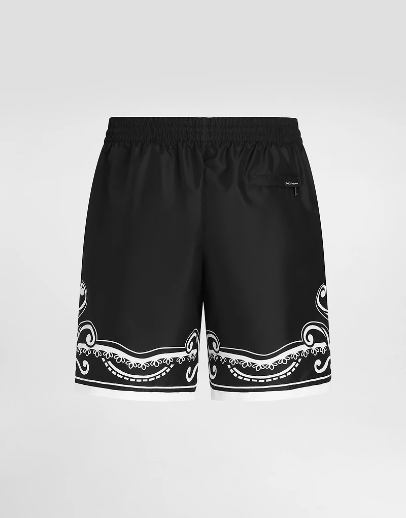 Mid-length swim trunks with bandanna print