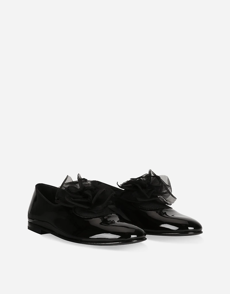 Patent leather slippers with flower appliqué