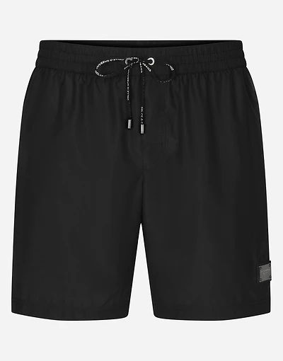 Mid-length swim trunks with branded plate