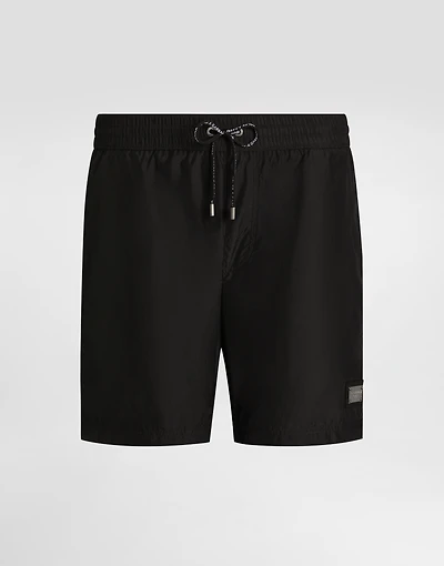 Mid-length swim trunks with logo tag