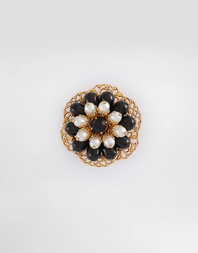 Metal brooch with rhinestones