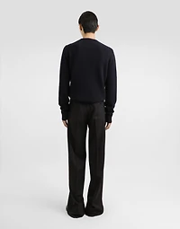 Wool round-neck sweater with bejeweled buttons