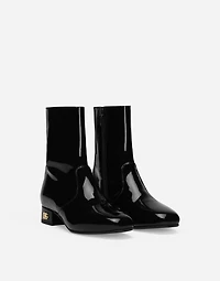 Patent leather ankle boots with branded heel