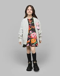 Neoprene dress with floral print over a black background