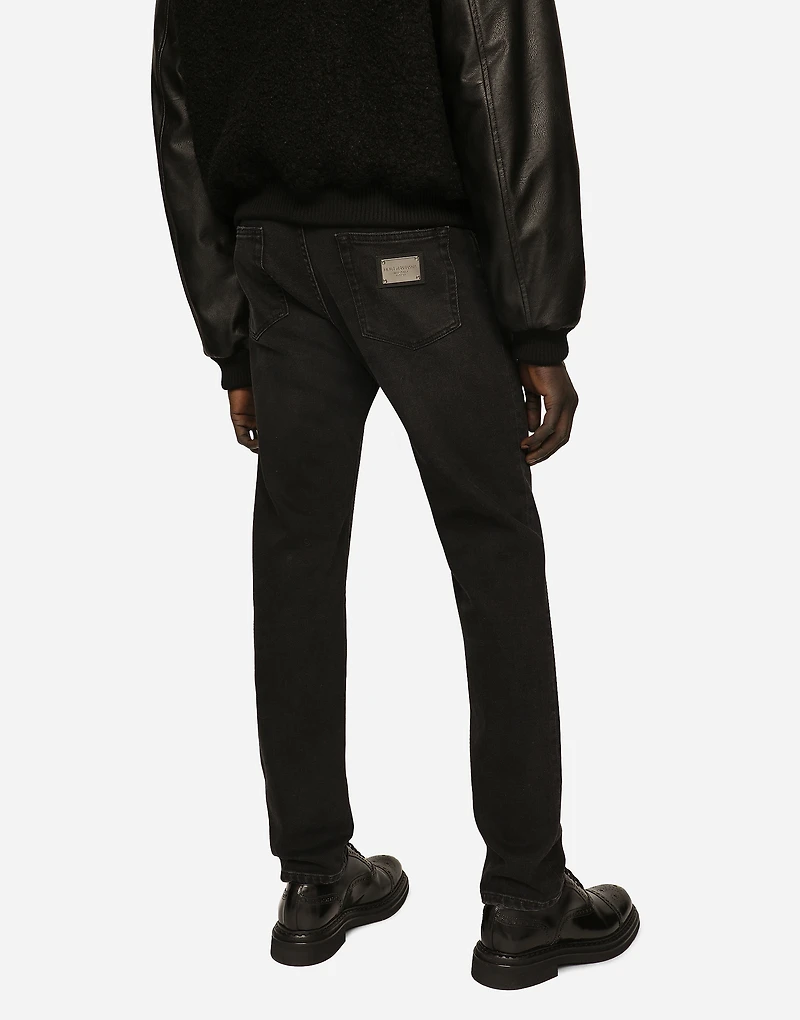 Slim fit stretch denim jeans with subtle abrasions