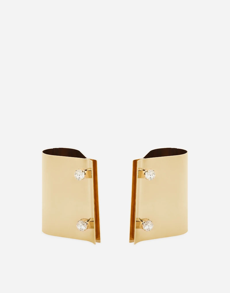 Rigid metal cuffs and rhinestone-detailed buttons