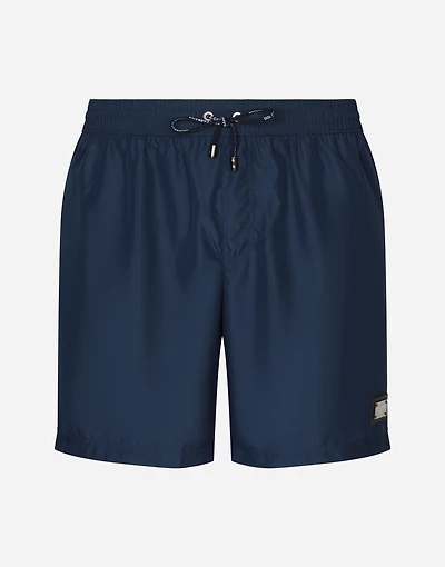 Long-leg swim trunks with branded tag