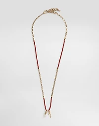 Metal necklace with gemstones and charms