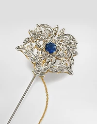 Sicily Brooch  18-carat yellow and white gold, blue sapphires, and diamonds