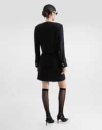 Short raschel tweed A-line skirt with bejeweled buttons