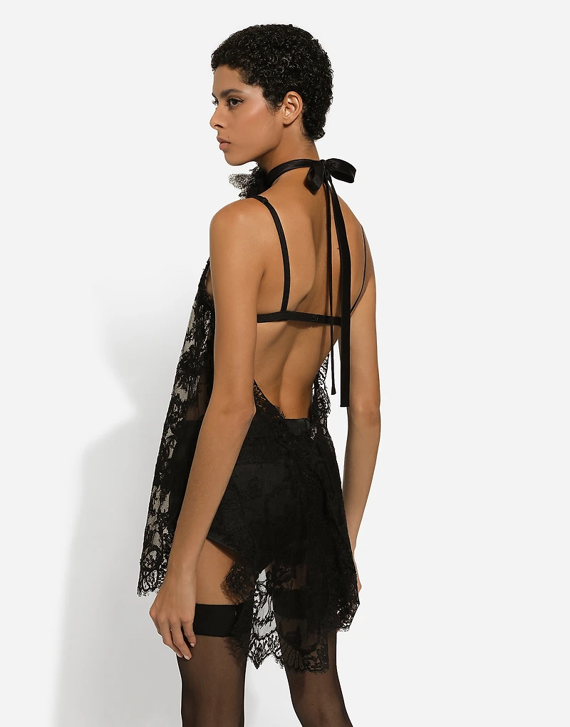 Asymmetrical lace top with flower detail on neck