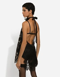 Asymmetrical lace top with flower detail on neck