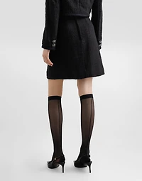 Short raschel tweed A-line skirt with bejeweled buttons