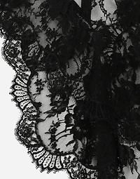 Asymmetrical lace top with flower detail on neck