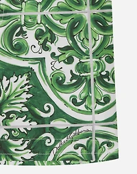 Nylon swim trunks with green majolica print