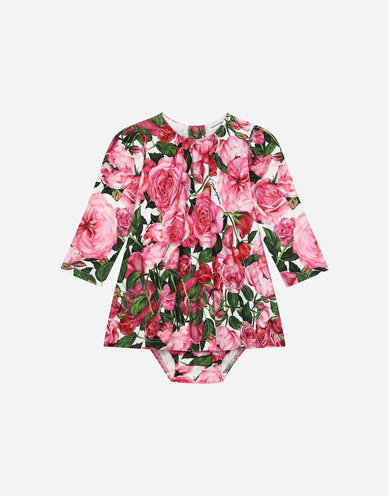 Interlock dress with rose print over a white background