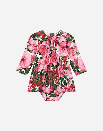 Interlock dress with rose print over a white background